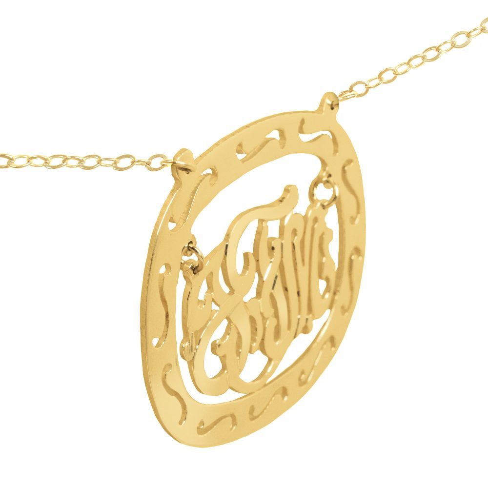 14K gold-plated silver oval monogram necklace inside thick patterned circular frame Angle