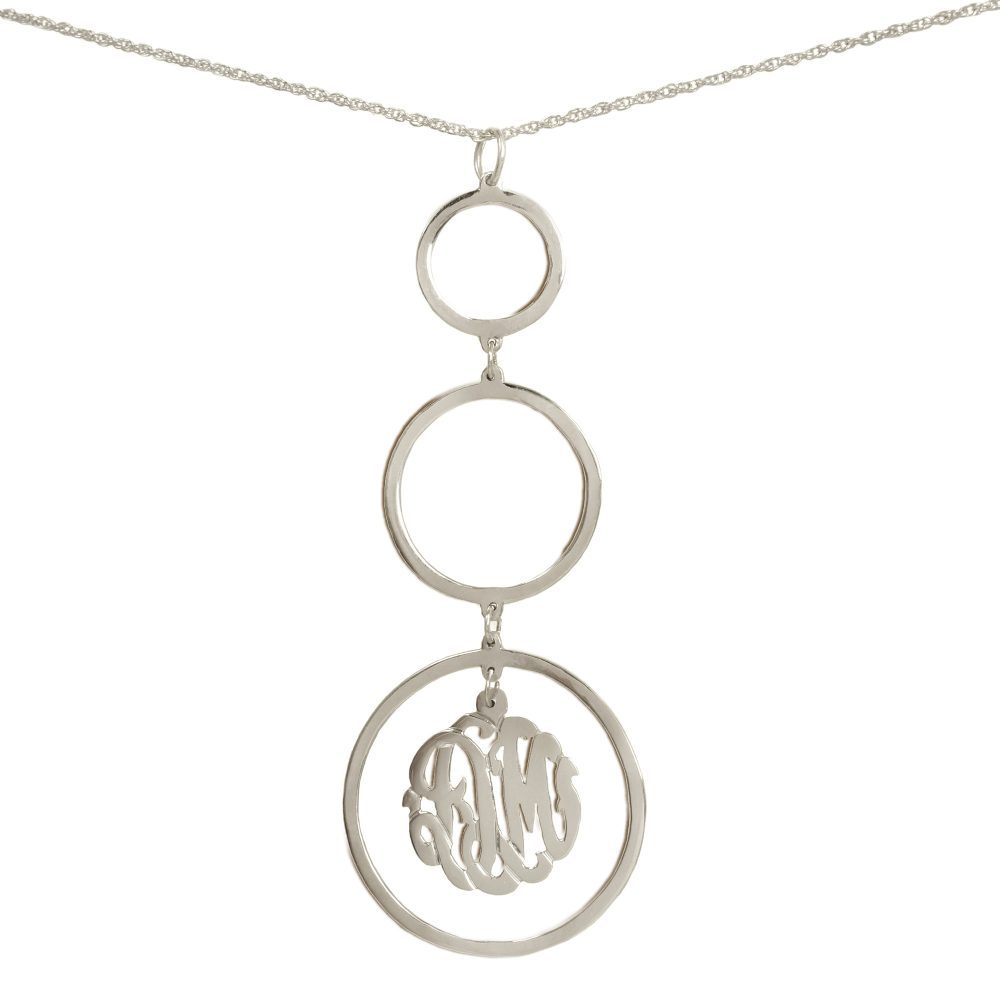 silver necklace with three hanging circular pendants with a monogram inside bottom pendant