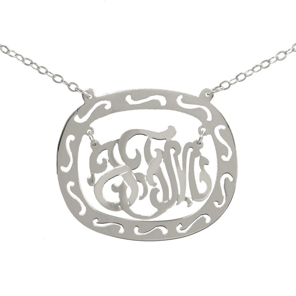 silver oval monogram necklace inside thick patterned circular frame