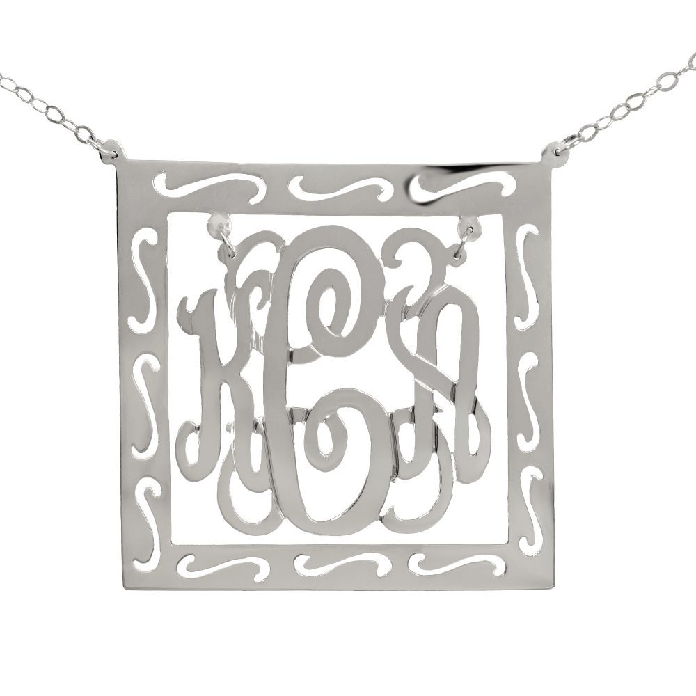 silver round monogram necklace inside patterned square frame