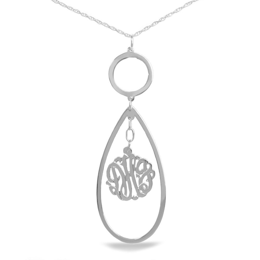 silver necklace with monogram hanging inside a hollow teardrop pendant below a small circular pendant